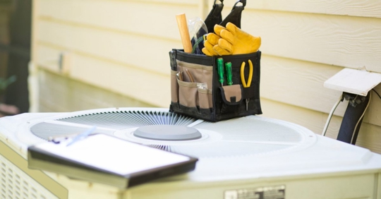 Tool bag on outdoor AC unit